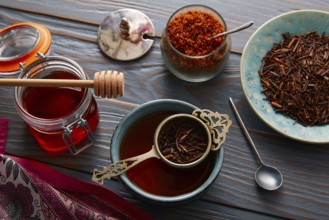 Kukicha tea served in bowl on wooden table board