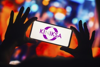 In this photo illustration, the Kiniksa Pharmaceuticals logo is displayed on a smartphone mobile