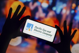 In this photo illustration, the Pacific Gas and Electric Company (PGE) logo is displayed on a