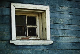 Old blue wooden textured wall, grunge boards and window