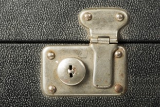 Lock of an old travel suitcase. Close up lock