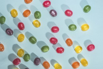 Candy scattered on the wooden table