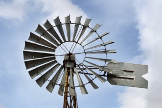 Old windmill over blue sky