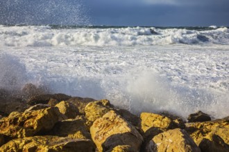 New Quay in the Old Jaffa in a winter storm. Huge foaming waves of the Mediterranean beat against