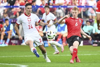 BERLIN, GERMANY - JUNE 21, 2024: Euro 2024 Groupe D match Poland vs Austria 1:3. Bartosz Slisz (L)