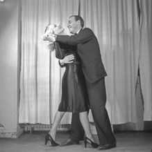 Dancing in the 1940s. A dancing couple in the 1940s. The elegant couple are training their dance