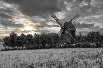 A view of a beautiful windmill in Thuringia Germany in a natural setting and an eye catcher for