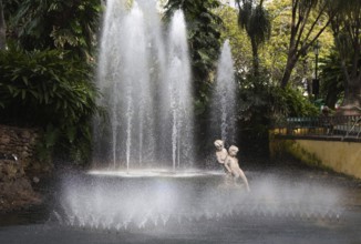 A fountain with figures of playing children in Funchal on Madeira Island