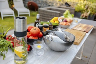 Fresh ingredients for cooking on the outdoor table