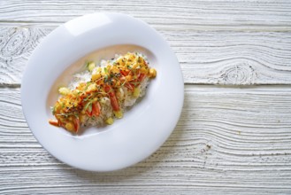 Seafood red curry with shrimps prawns sprouts and sesame seeds