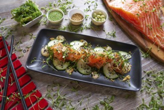 Wakame algae salad with salmon wasabi sesame and sprouts