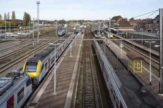 Aarschot, Flemish Brabant, Belgium, 11 11 2022, Trains driving the tracks at the railway station,