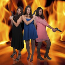 Beautiful women with loaded handgun pistols
