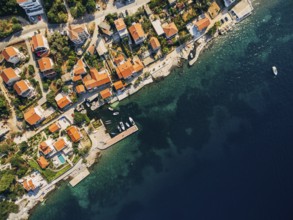 Aerial footage from the drone - villas, houses and hotels on the beach in Montenegro, the Adriatic