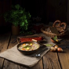 Rustic sauerkraut soup with bacon and sausage