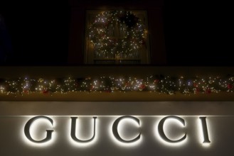 Illuminated lettering of the brand Gucci, Christmas decoration, Roermond, Netherlands
