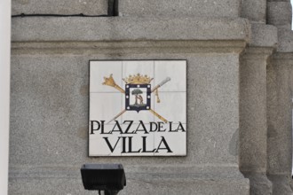 Coat of arms sign on a stone wall with the inscription 'Plaza de la Villa', Madrid, Spain, Europe