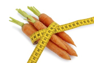 Organically grown carrots with measuring tape Fresh fruit and vegetables are always healthy.