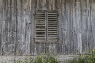 Wooden wall with closed wooden shutters from the former Brunner staff house which has since been