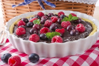 Chocolate tartelette with forest fruits