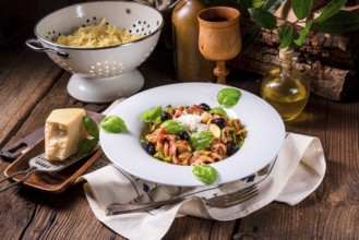 Ribbon Pasta with courgette and olives in tomato sauce