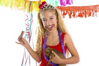 Happy party girl with puppy present eating chocolate in birthday dirty mouth