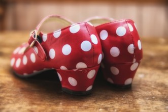 Red dance shoes with white dots