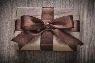 Boxed vintage gift container with brown ribbon celebration concept