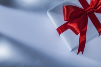Wrapped red gift box on white background
