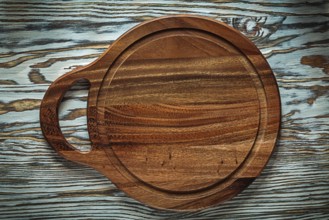 Carving board on wooden surface