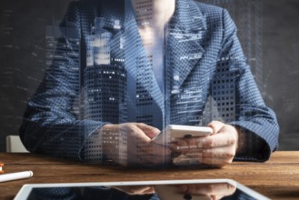 Businesswoman using mobile phone at desk. Close up woman hands and tablet computer. Mobile
