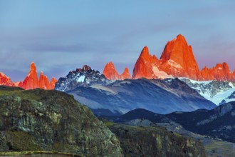 The grand crimson dawn over the mountain range Fitzroy. Mountain peak in Patagonia. Magnificent