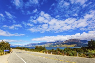 South Island. The beautiful lake Wanaka in New Zealand. Cirrus clouds fly in the sky. Azure lake