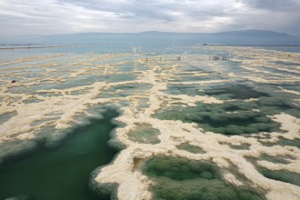 Drone photography. Salt evaporated from the water forms bizarre patterns in the shallow sea water.