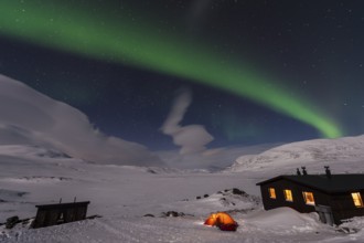 Northern Lights (Aurora borealis) over moonlit mountains on the long-distance hiking trail