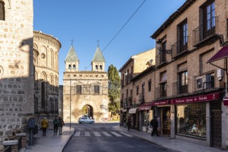 Toledo, Spain, December 6, 2019: The New Bisagra Gate and Santiago del Arrabal church. Real del