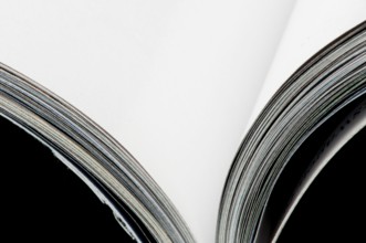 Open magazine blank pages. Close up