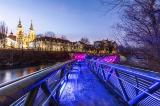 Illuminated Murinsel, Mariahilferkirche in the background, night shot, Graz, Styria, Austria,