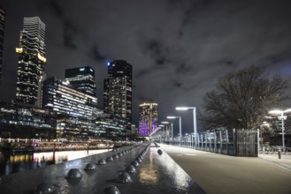 MELBOURNE, AUSTRALIA - JULY 5, 2024: Melbourne skyline as seen at dusk from Sandridge Bridge near