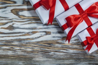 Red packed present boxes on wooden surface