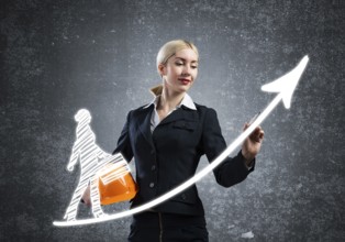 Business lady drawing success graph of professional career. Strategy planning and development of