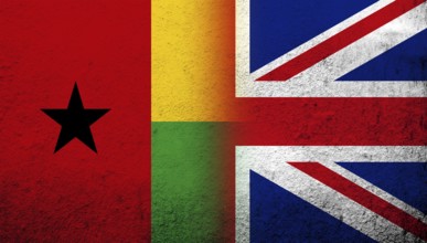 National flag of United Kingdom (Great Britain) Union Jack with The Republic of Guinea-Bissau