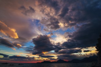 Sunset in Montenegro over the mountains and the sea. Orange sunsets