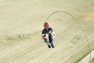 Jumping with a rope.extreme man jumping from a great height.jumping with a rope.flying down on the