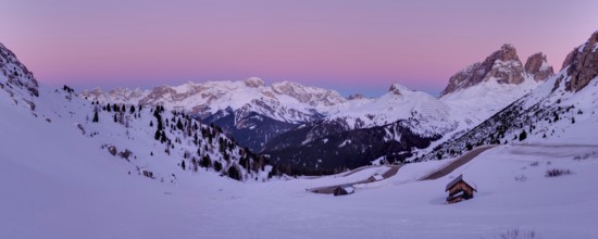 Winter landscape in Passo Role before sunrise in winter