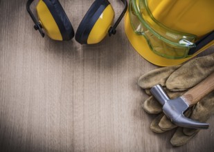 Claw hammer safety glasses protective gloves hard hat ear muffs