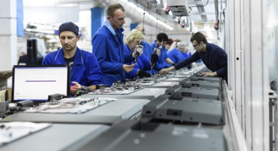 Conveyor for the production of television sets. Testing TVs in the workshop. Electronics Assembly
