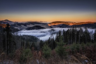 Fog over the Liptov village of Velke Borove before sunrise by Liptovska Mara in Slovakia