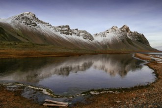 Vestrahorn mountain range and Stokksnes beach panorama, near Hofn, Iceland. Vatnajokull National