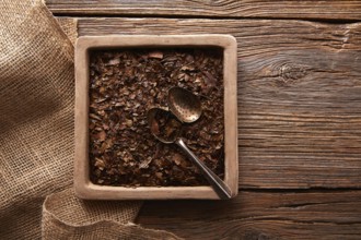 Bancha tea texture on wooden aged background